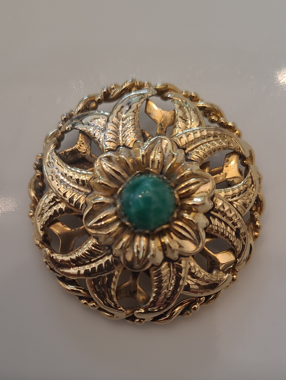 Vintage 1950s Riveted Gold Tone Filigree Flower Brooch with a Turquoise Cabochon
